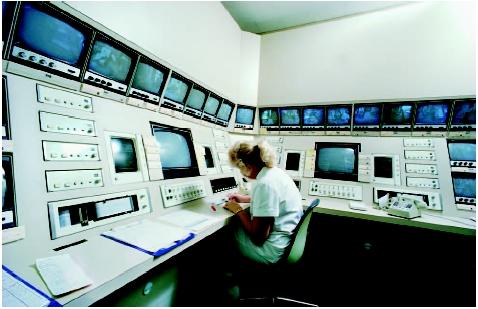 Nurse monitoring a central station for intensive care unit (ICU) equipment. (Custom Medical Stock Photo. Reproduced by permission.)
